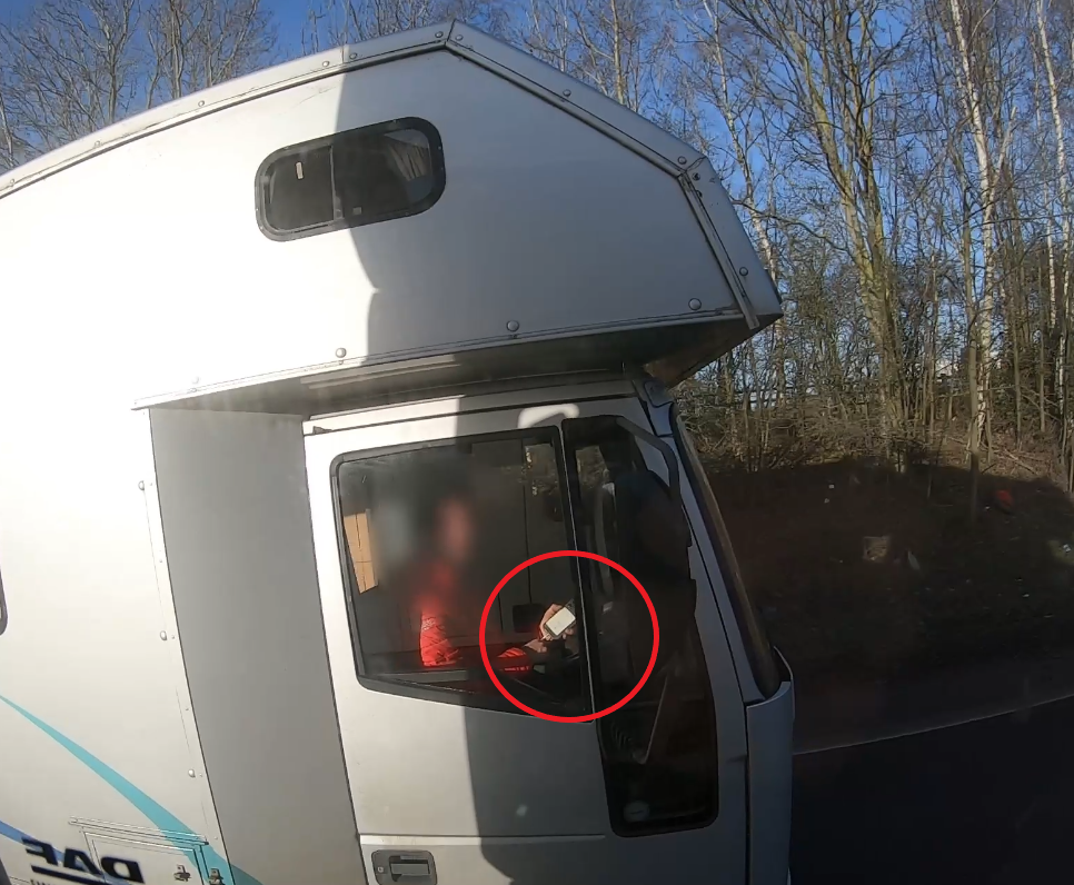Caption: Watch footage here of this driver using his mobile phone on the A46 Coventry Eastern Bypass