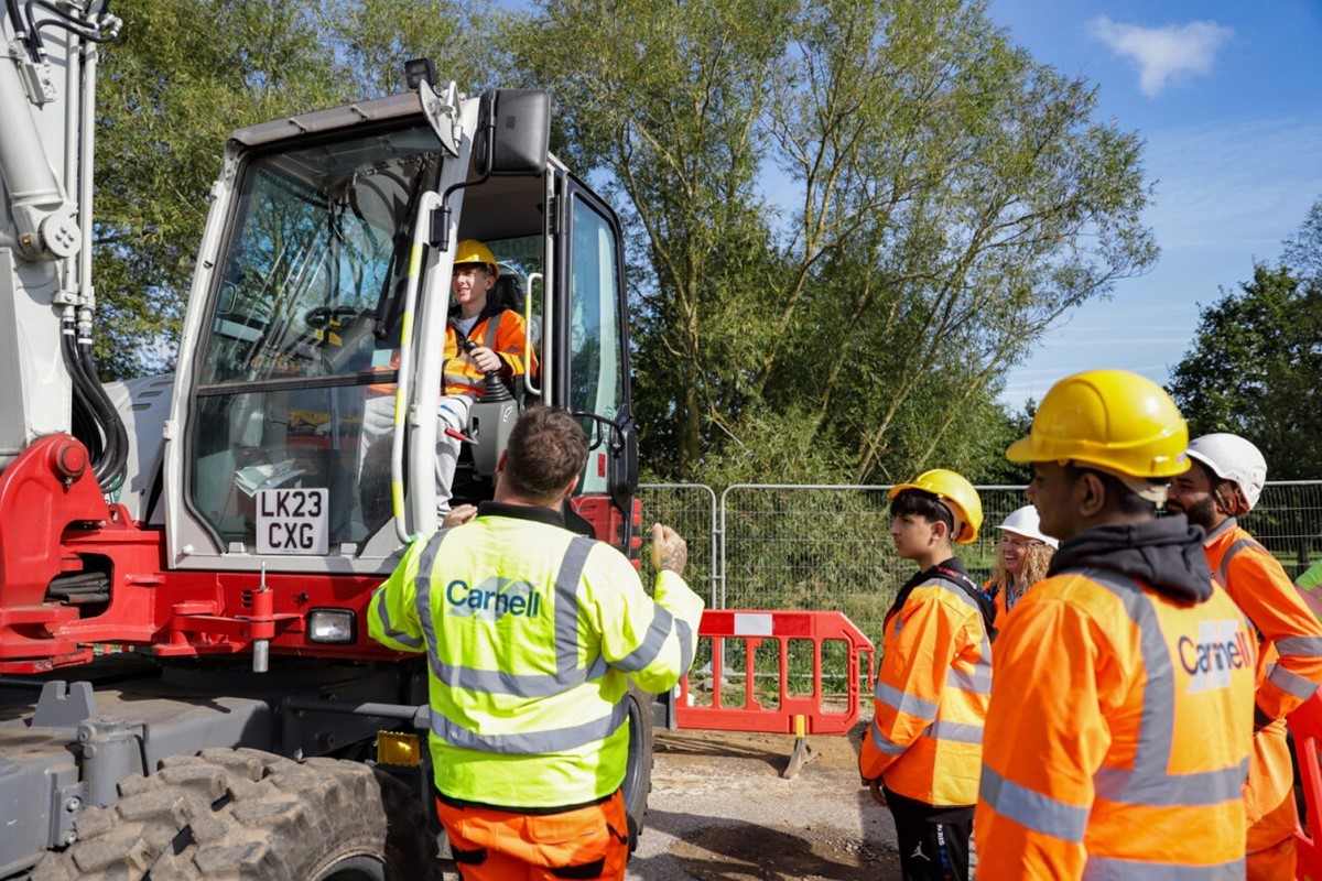 Caption: Youngsters were able to look more closely at plant machinery used in construction projects in a special cordoned off area of the construction site.